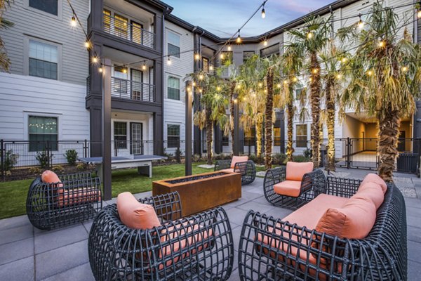 Cozy outdoor fire pit area at Westhouse Apartment Flats, ideal for gathering and relaxation in the serene community setting