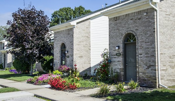Hidden Lakes Apartments: Serene lakeside view of modern luxury apartments
