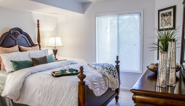 Cozy bedroom with lake view at Hidden Lakes Apartments