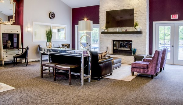 Elegant clubhouse lobby with modern furnishings at Hidden Lakes Apartments, featuring luxury amenities in a serene lakeside setting