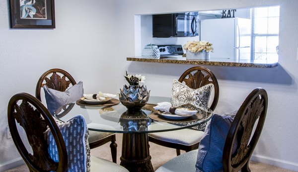 Elegant dining room with contemporary furnishings in Hidden Lakes Apartments