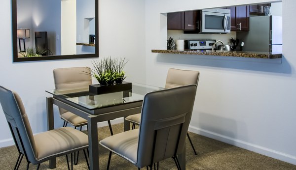 Dining room featuring elegant lighting and modern decor in Hidden Lakes Apartments