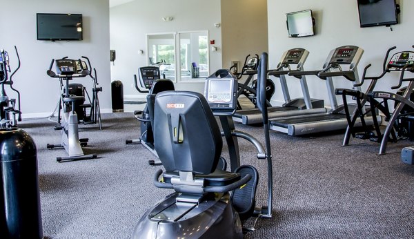 Modern fitness center with state-of-the-art equipment at Hidden Lakes Apartments offering a dynamic workout environment