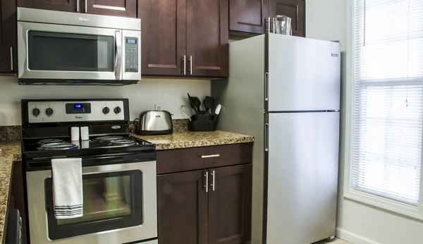 Modern kitchen with stainless steel appliances at Hidden Lakes Apartments