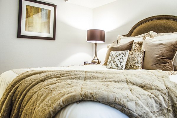 Bedroom featuring elegant decor and plush bedding at Laurel Valley Apartments