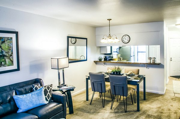 Spacious living room with modern decor and large windows in Laurel Valley Apartments