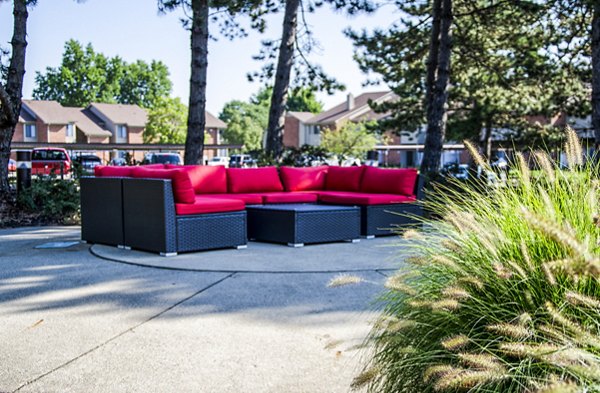 Cozy patio with outdoor seating at Laurel Valley Apartments, perfect for relaxation and enjoying lush greenery views