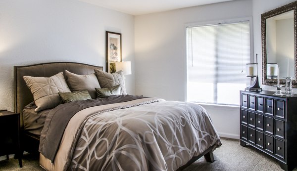 Elegant bedroom with modern furnishings at Oak Hill Apartments