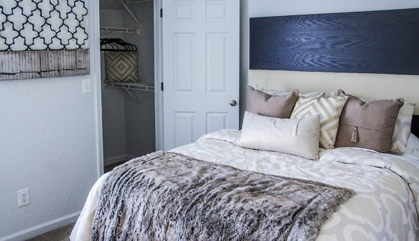 Cozy bedroom with modern furnishings at Oak Hill Apartments