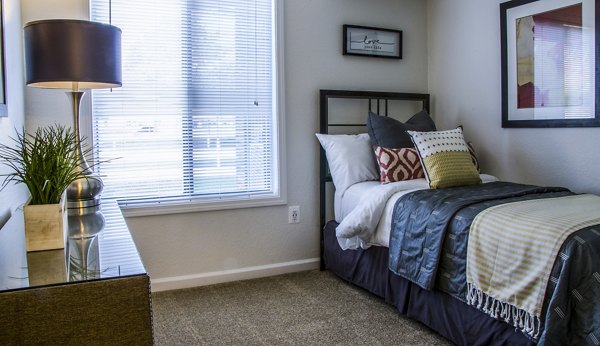 Bedroom featuring modern design and cozy furnishings at Oak Hill Apartments