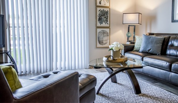 Spacious living room featuring modern furnishings at Oak Hill Apartments