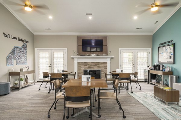 Clubhouse featuring modern design and ample seating at Shoal Creek Apartments