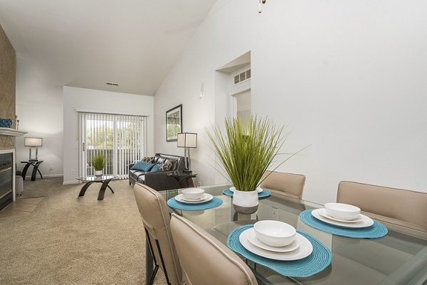 Dining area with modern furnishings at Shoal Creek Apartments, featuring sleek table and chairs, perfect for entertaining and comfort