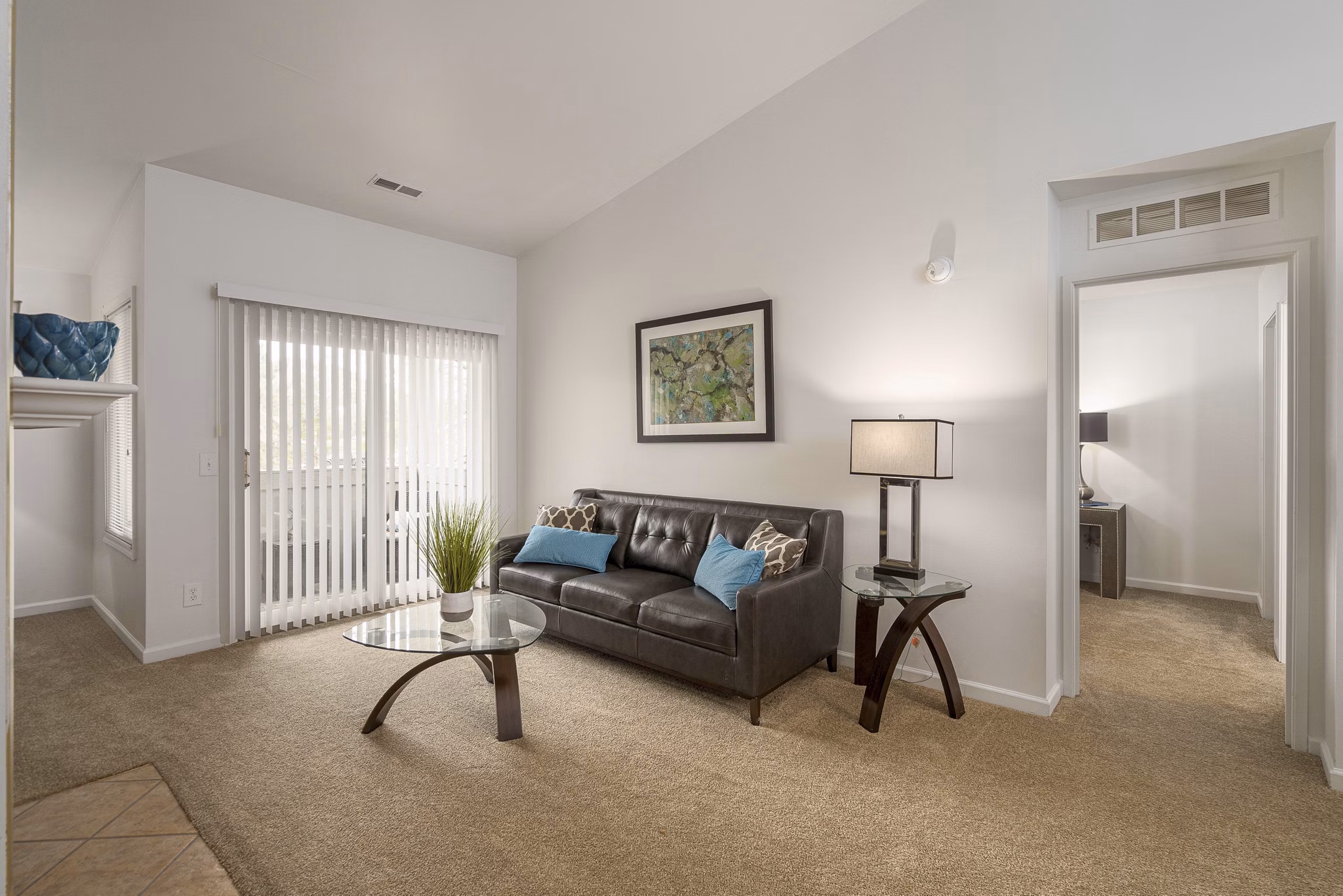 Inviting living room with modern decor and ample natural light at Shoal Creek Apartments