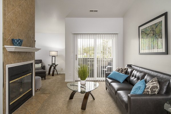 Spacious living room with modern furnishings at Shoal Creek Apartments