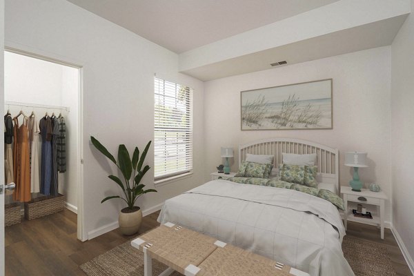 Cozy bedroom with a plush bed and modern decor at Woodland Meadows Apartments