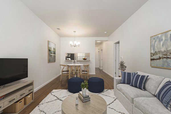 Spacious living room with modern decor at Woodland Meadows Apartments