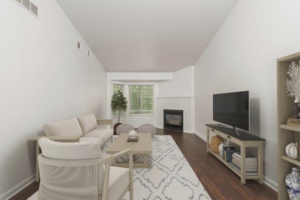 Spacious living room with modern decor and ample natural light at Woodland Meadows Apartments