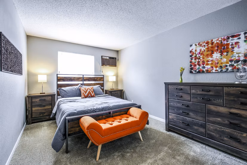 Cozy bedroom with modern furnishings at Avana West Park Apartments, a luxury living destination