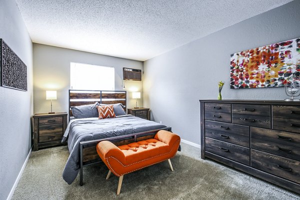 Cozy bedroom with modern furnishings at Avana West Park Apartments, a luxury living destination