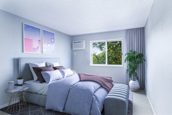 Modern bedroom featuring sleek furnishings and natural light at Avana West Park Apartments