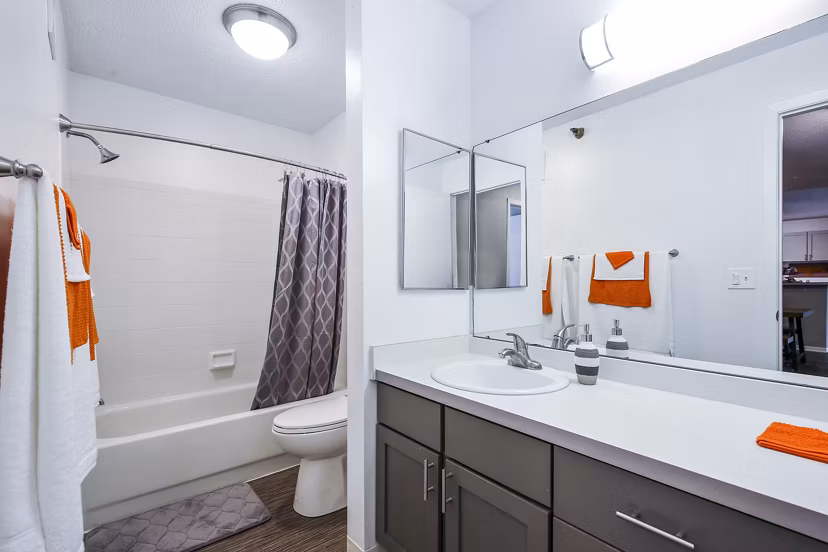 Modern bathroom featuring sleek fixtures and large vanity at Avana West Park Apartments