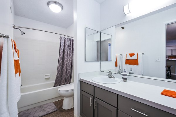 Modern bathroom featuring sleek fixtures and large vanity at Avana West Park Apartments