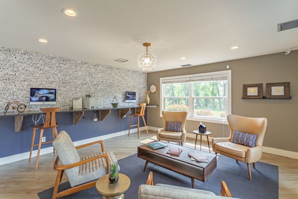 Modern clubhouse featuring cozy seating and gaming area at Avana West Park Apartments