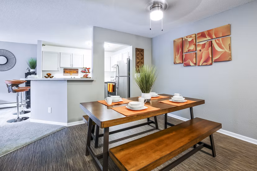 Dining room featuring elegant dining set and modern lighting in Avana West Park Apartments