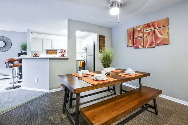 Dining room featuring elegant dining set and modern lighting in Avana West Park Apartments