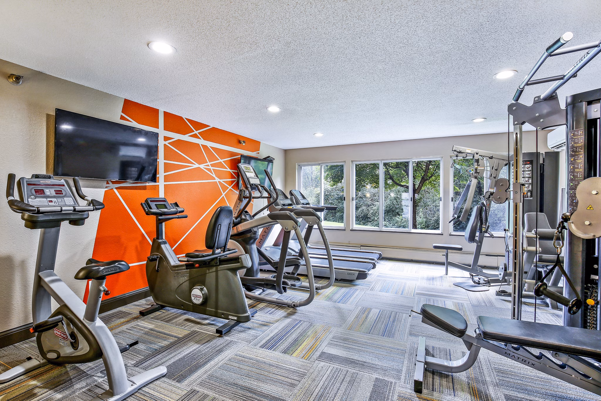 State-of-the-art fitness center with modern equipment at Avana West Park Apartments