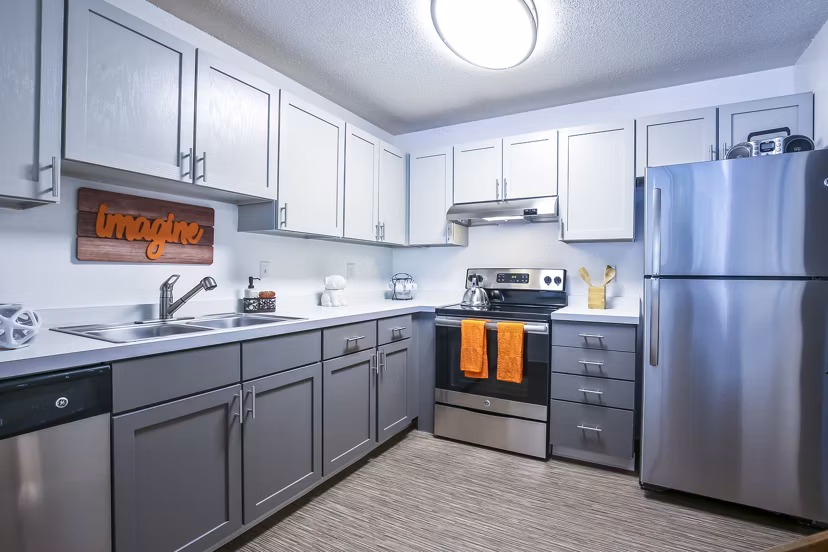 Modern kitchen featuring stainless steel appliances at Avana West Park Apartments Cozy and functional space for luxury living