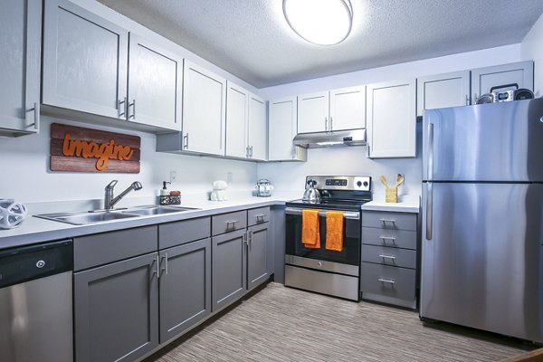 Modern kitchen featuring stainless steel appliances at Avana West Park Apartments Cozy and functional space for luxury living
