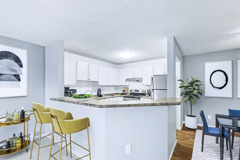 Modern kitchen with stainless steel appliances at Avana West Park luxury apartments in a Greystar community