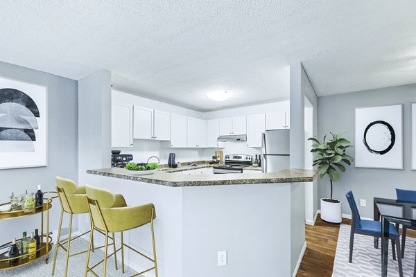 Modern kitchen with stainless steel appliances at Avana West Park luxury apartments in a Greystar community