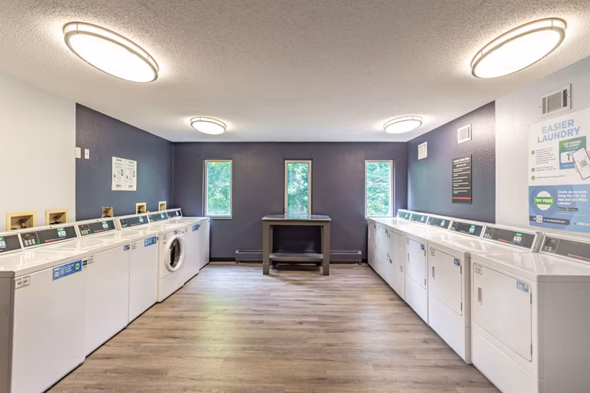 Modern laundry facility with energy-efficient machines at Avana West Park Apartments