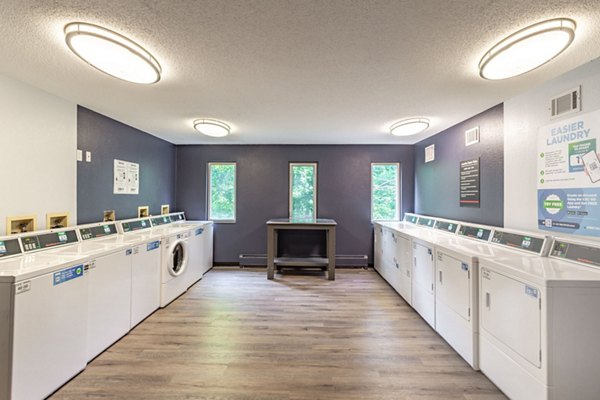 Modern laundry facility with energy-efficient machines at Avana West Park Apartments