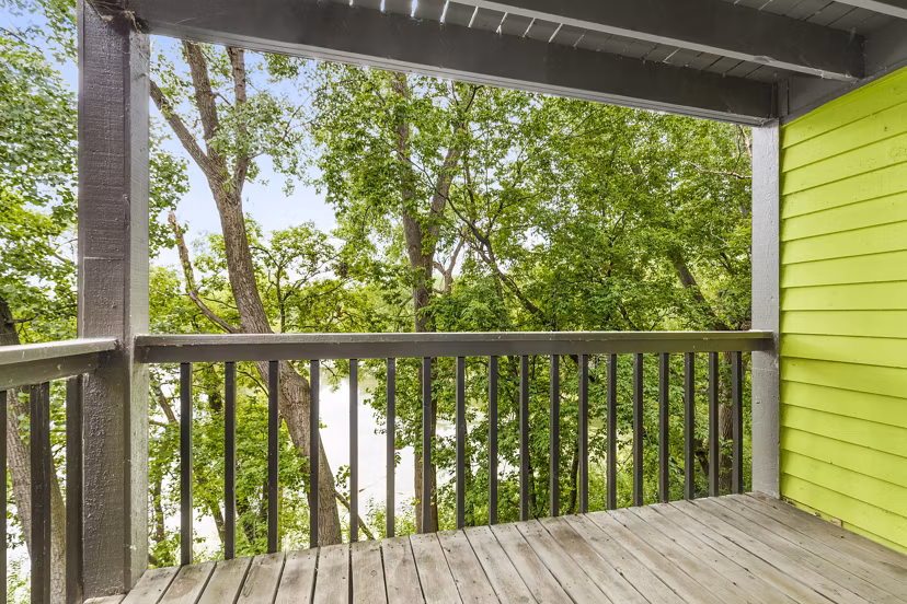 Cozy patio with garden views at Avana West Park Apartments