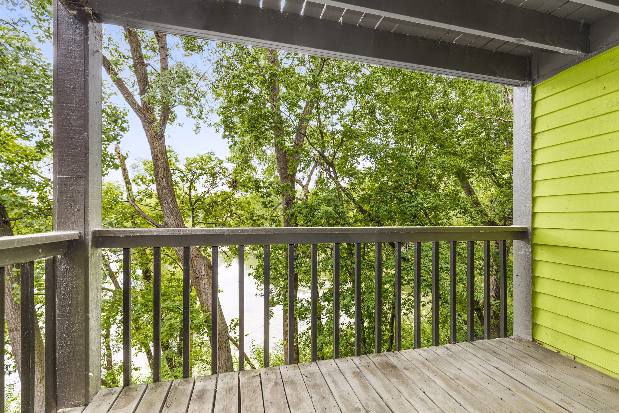 Cozy patio with garden views at Avana West Park Apartments