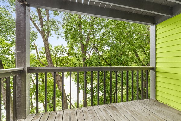 Cozy patio with garden views at Avana West Park Apartments