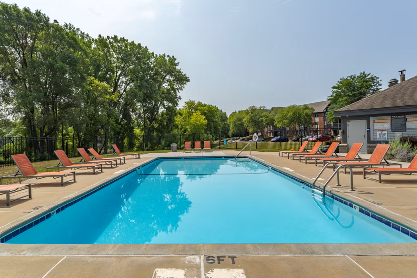 Inviting outdoor pool with lounging area at Avana West Park Apartments