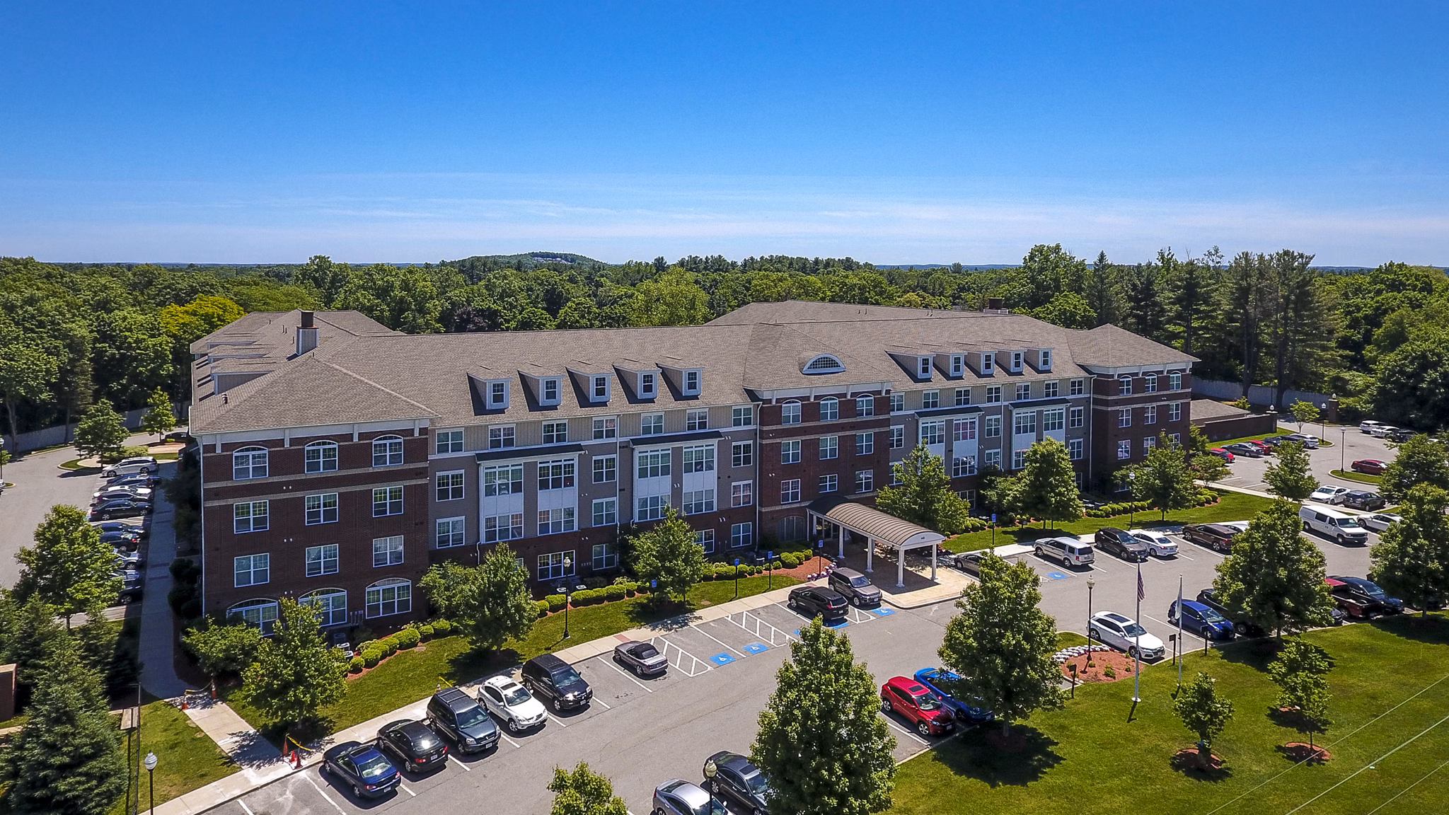 Luxury apartments with spacious parking and lush greenery in a serene setting