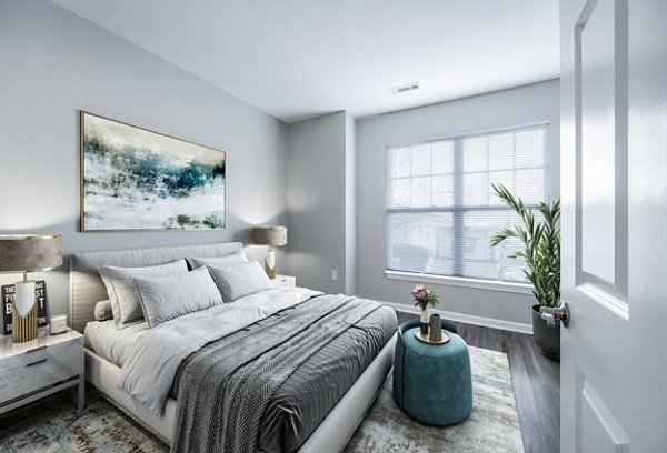 Cozy bedroom with modern decor at Marquee at Andover Apartments