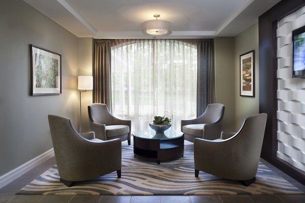 Clubhouse featuring modern lounge seating and community spaces at Marquee at Andover Apartments