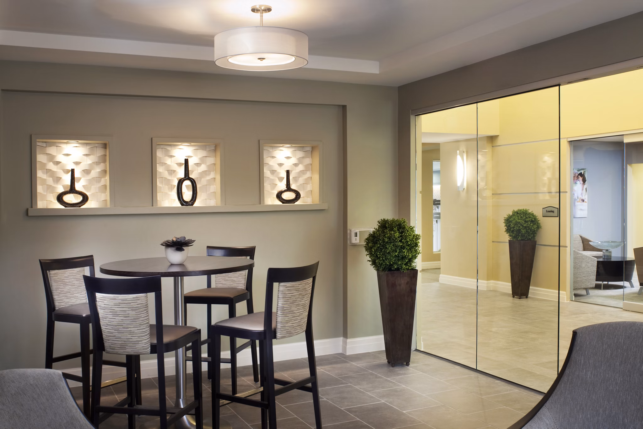 Clubhouse featuring modern design and amenities at Marquee at Andover Apartments, ideal for community gatherings and leisure activities