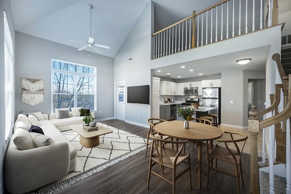 Spacious living room with modern furnishings at Marquee at Andover Apartments