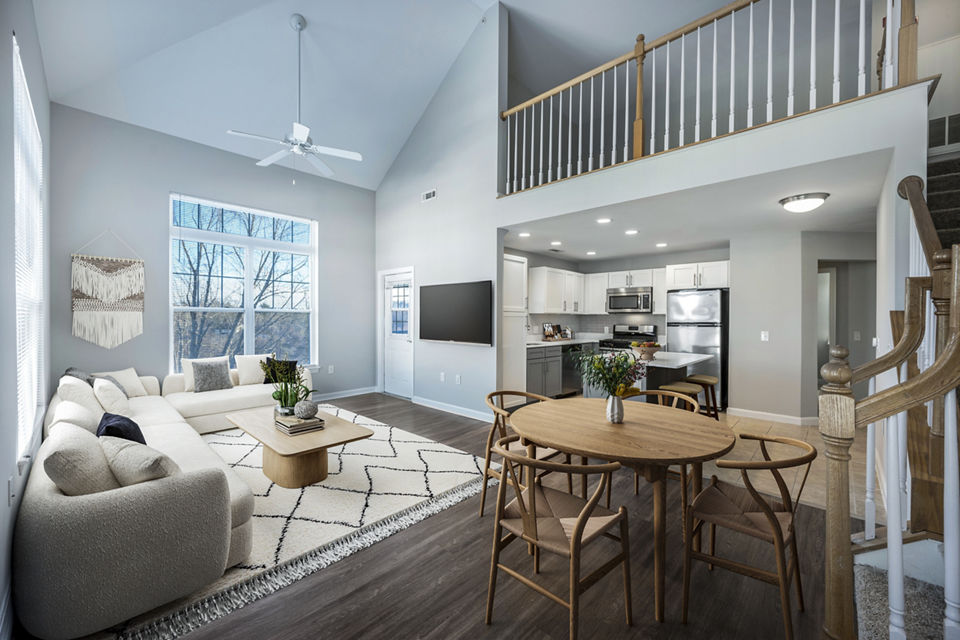 Spacious living room with modern furnishings at Marquee at Andover Apartments