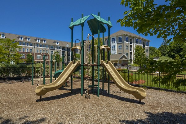 Marquee at Andover: Modern playground with swings and slides for family-friendly living at luxury apartments