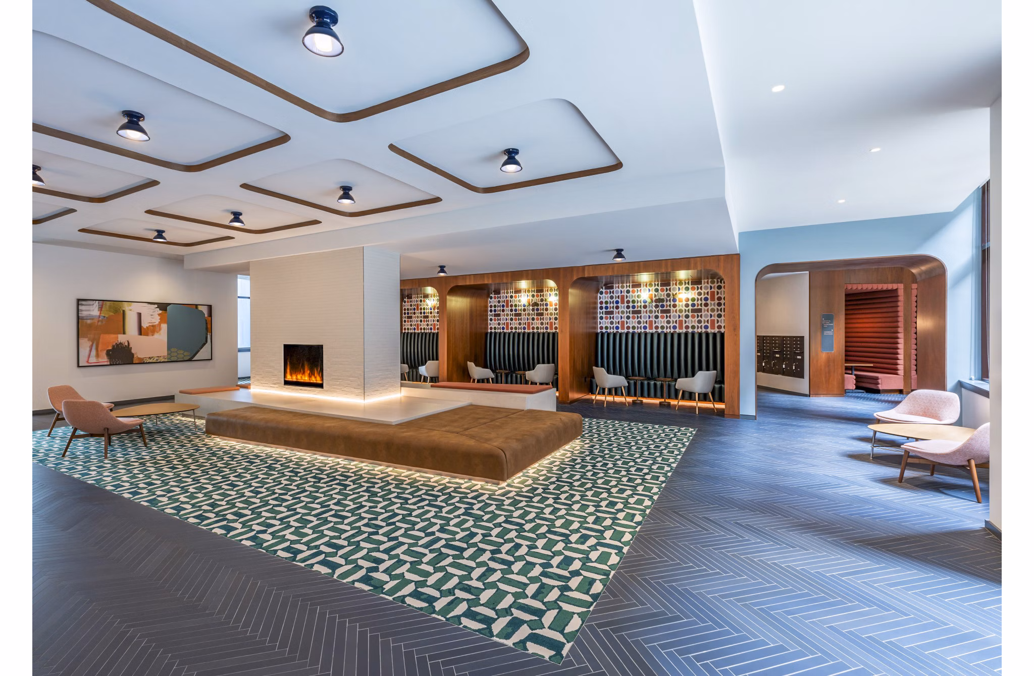 Modern clubhouse with vibrant decor at Illume Apartments, designed for social gatherings and community events