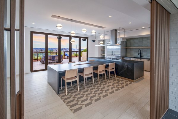 Clubhouse featuring modern furnishings and open layout at Illume Apartments